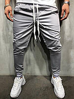 Серые мужские спортивные штаны с внешними карманами молодёжные зауженные модные