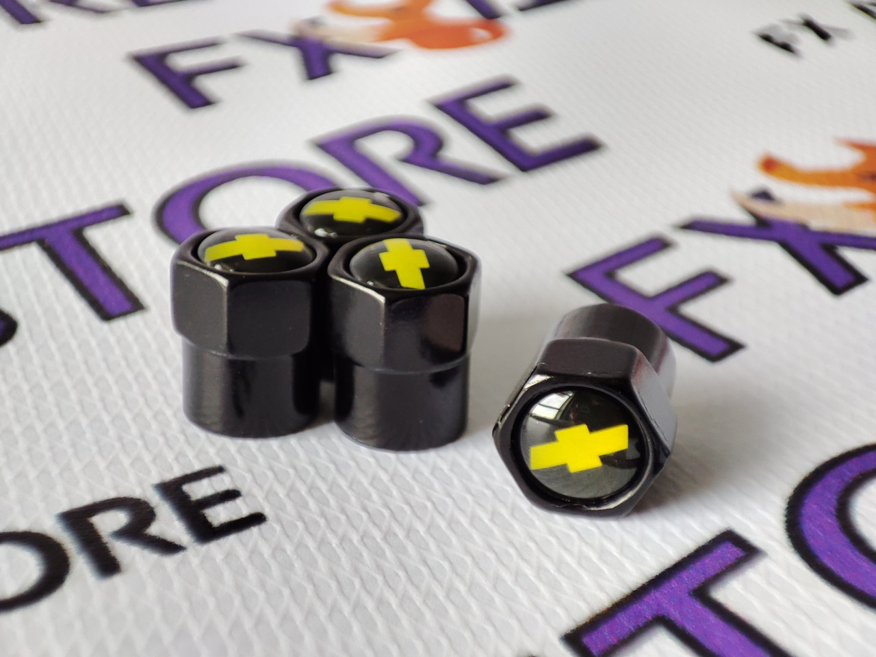 Захисні ковпачки на ніпеля Chevrolet чорні шестигранні, 4 шт., фото 1