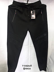 Чоловічі чорні спортивні трикотажні теплі штани на манжетах у розмірі М