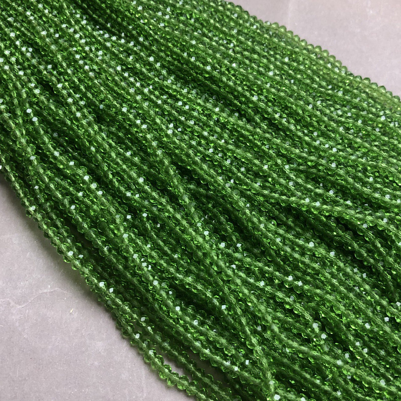 Намистини Чеський Кришталь на волосіні світло-зелене прозоре гранований рондель d-3,5х3мм + - L-36-38см + - купити біжутерію