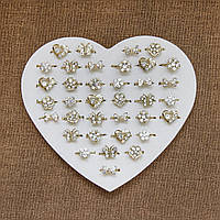 Колечки детские металлические с белыми стразиками бабочки сердечки цветочки регулируемые в наборе 36 штук