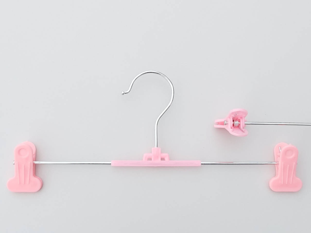 

Плечики металлические для брюк и юбок с пластмассовой прищепкой розового цвета, длина 30 см, Розовый