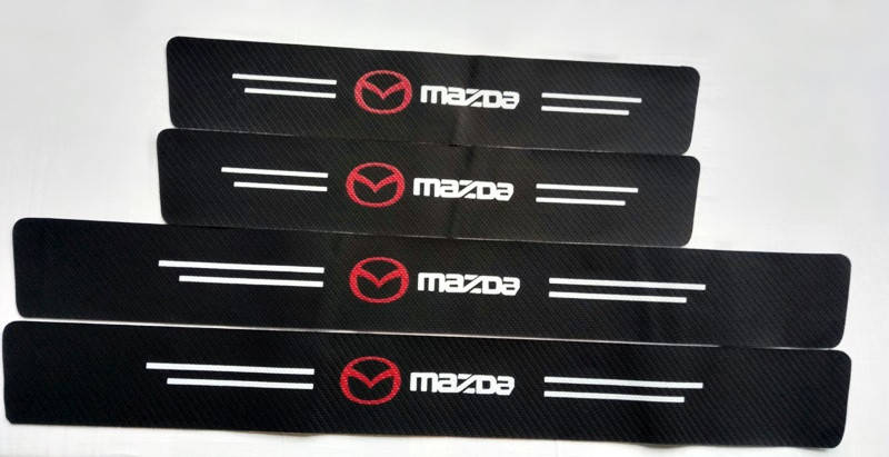 

Виниловые (карбоновые) накладки на пороги Mazda