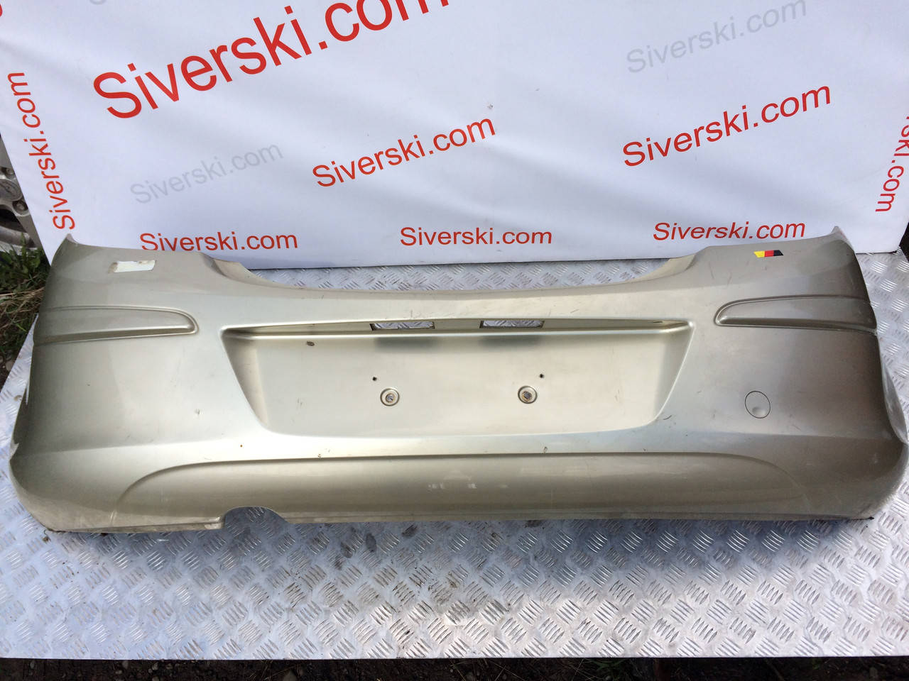 

Бампер задний, буфер, накладка Opel Corsa D (остался черный)