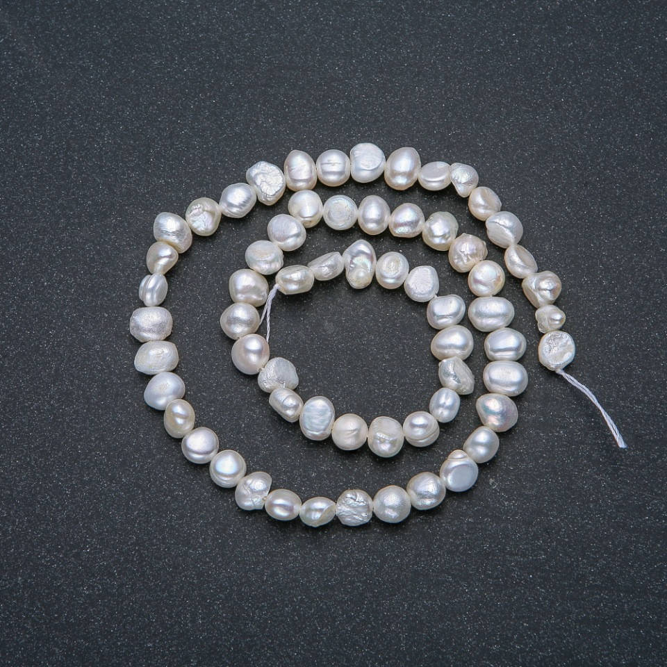 

Нитка Речного Жемчуга d-6мм L-37см +- с отливом бензин