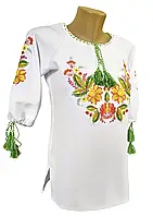 Біла жіноча вишиванка з квітковим орнаментом у велики «Петриківський розпис» 46-54
