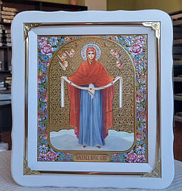 Ікона Покров Пресвята Богородиця у білому фігурному кіоті під склом, розмір кіота 30×26, сюжет 20×24.