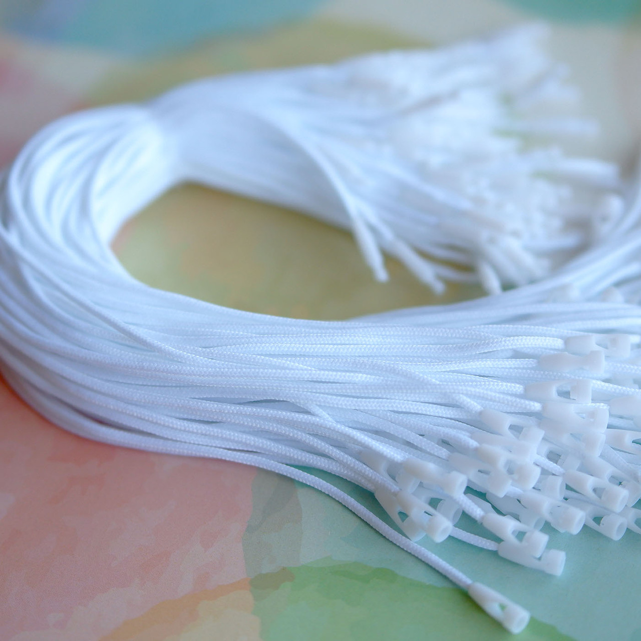 Купить биркодержатели оптом, шнурки для бирок, премиальные ...