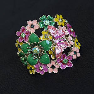 Браслет жіночий масивний золотистого кольору квіточки з метеликом покритий акрилом застібка шарнірна ширина 70 мм