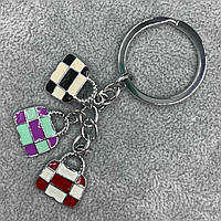 Брелок металевого сріблястого кольору різнобарвні сумочки в клітинку покритий кольоровою емаллю довжина 9 см