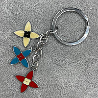 Брелок металевого сріблястого кольору різнобарвні бумеранги покритий кольоровою емаллю довжина 8,5 см