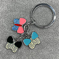 Брелок металевого сріблястого кольору різнобарвні метелики з візерунками покритий кольоровою емаллю довжина 8,5 см