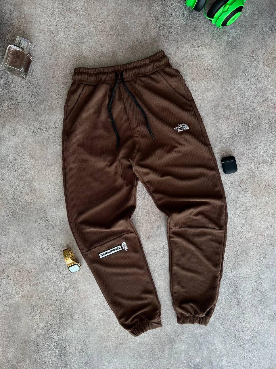 Чоловічі спортивні штани The North Face M1217 коричневі, фото 1