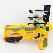 Дитячий іграшковий пістолет з літачками Air Battle катапульта з літаючими літаками (AB-1). Колір: жовтий, фото 3