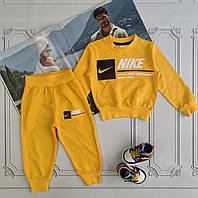 Детский желтый прогулочный костюм Nike