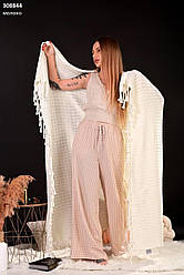 Плед в'язаний із балабонами