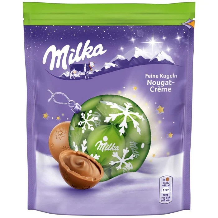 Рождественские шоколадные шарики Milka с начинкой из нуги 90 грамм Германия - фото 1 - id-p1532219439