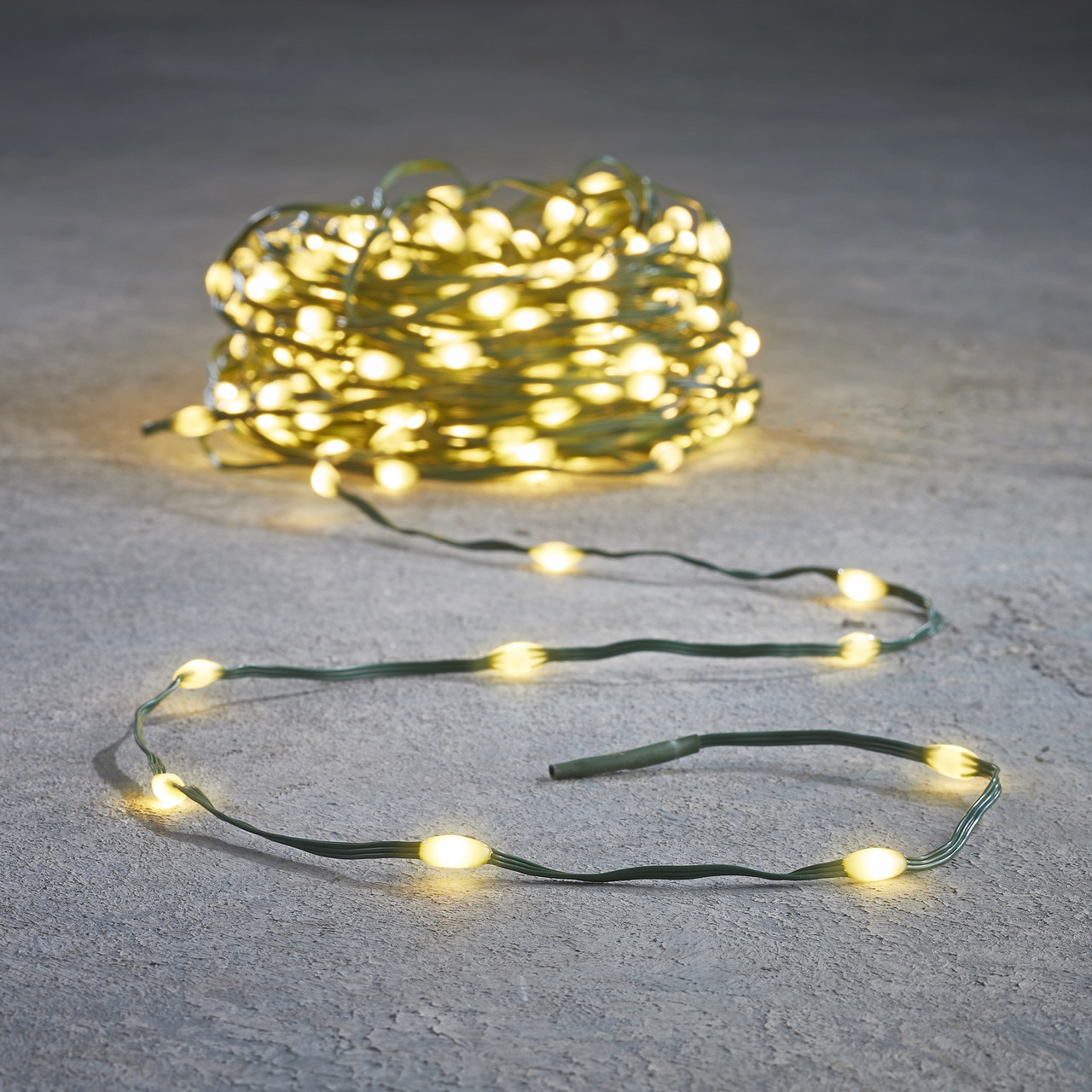 Гірлянда новорічна світлодіодна Luca Lighting Струна 15+3 м, 200 LED, зелений провід, теплий білий