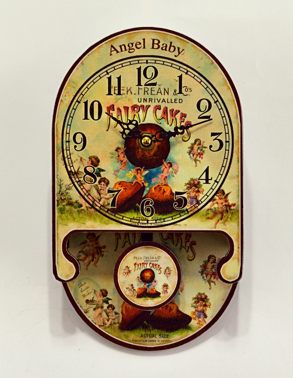 Кварцовий настінний годинник з маятником "Angel Baby" розмір 24 x 13,8 x 3,5 см.