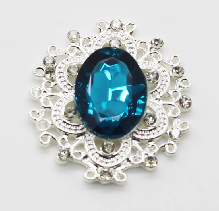 Камінь у сріблястій ажурній оправі 30*32 мм темно бірюзовий, фото 1