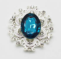 Камінь у сріблястій ажурній оправі 30*32 мм темно бірюзовий