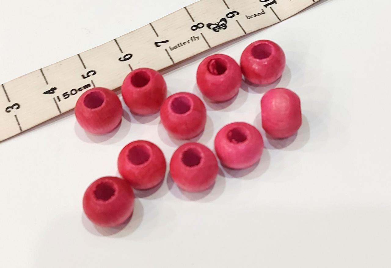 Намистини дерев'яні, коралики 10 мм, отвіт 4 мм. Розовые лаковані 20 шт/уп.