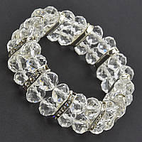 Браслет жіночий на руку на гумці з прозорими намистинами зі сріблястими елементами та білими кристалами