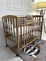 Ліжко AMELI з рухомою боковиною, дугами та колесами (бук)