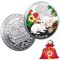 Серебряная монета белые кролики для новых возможностей и денег