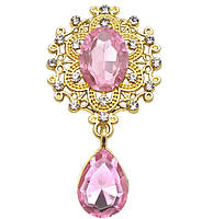 Шикарный камень в золотой оправе камень розовый с подвеской. Очень красиво смотрится.