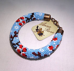 Блакитний браслет на руку з бісеру ручної роботи "Зимова горобина"