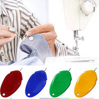 Прилад для продягання нитки в голку