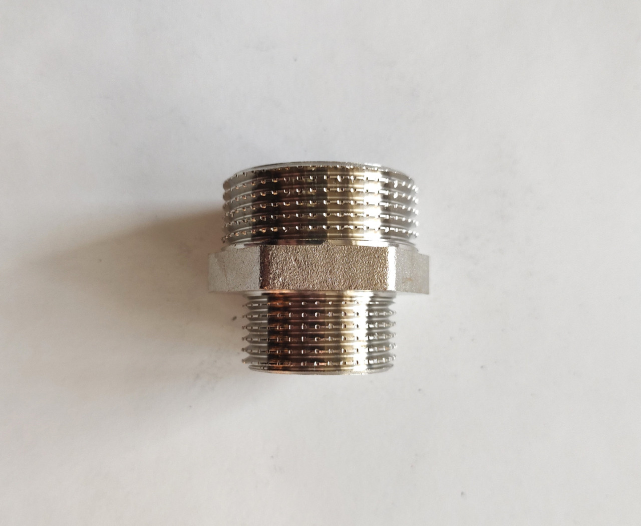 Ніпель 1/2"*3/4" нікель