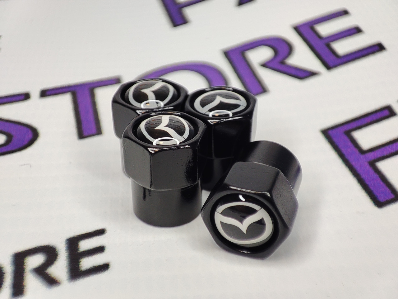 Захисні ковпачки на ніпелях MAZDA чорні шестигранні, 4 шт.