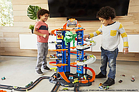 Трек Hot Wheels City Ultimate Garage Легендарный гараж 90см высоты GJL14 Track Set With Moving T-Rex Dinosaur