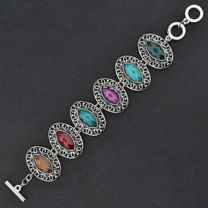 Браслет жіночий сріблястого кольору з різнобарвними камінчиками застібка тогл довжина 22 см ширина 30 мм