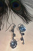 Серебристые ассиметричные серьги с голубым камнем от студии LadyStyle.Biz