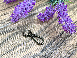 Карабін поворотний для сумки. Діаметр овальноі підставки - 1.5 см. Довжина - 4 см. Колір - бронза