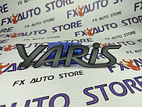 Эмблема шильдик логотип YARIS 135 X 30 мм черная матовая для Toyota