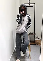 Теплий в'язаний жіночий костюм з широкими штанами і капюшоном