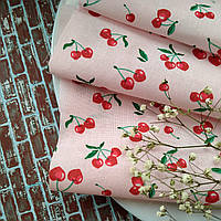 Тканина французька бавовна для рукоділля маленькі вишеньки на світло-рожевому тлі