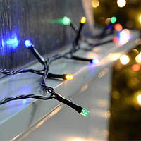 Новорічна гірлянда з яскравими різнокольоровими лампочками 9,5 метрів та чорним шнуром з вилкою для розетки топ