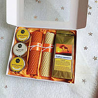 Вкусный, практичный подарочный набор с крем-медом,чаем, свечами в оранжевом цвете. Подарок женщине