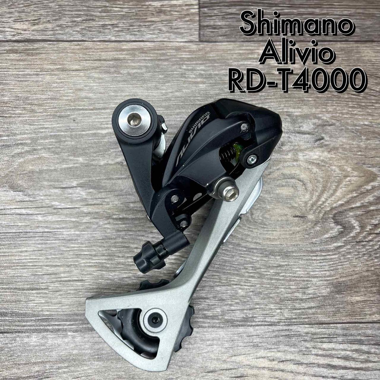 ΠΠ΅ΡΠ΅ΠΌΠΈΠΊΠ°Ρ Π·Π°Π΄Π½ΡΠΉ Shimano RD-T4000 ALIVIO ΡΠΎΡΠ½ΠΈΠΉ 9-ΡΠ²ΠΈΠ΄ΠΊΡΡΠ½ΠΈΠΉ, ΠΊΡΡΠΏΠ»Π΅Π½Π½Ρ ΠΏΡΠ΄ Π±ΠΎΠ»Ρ