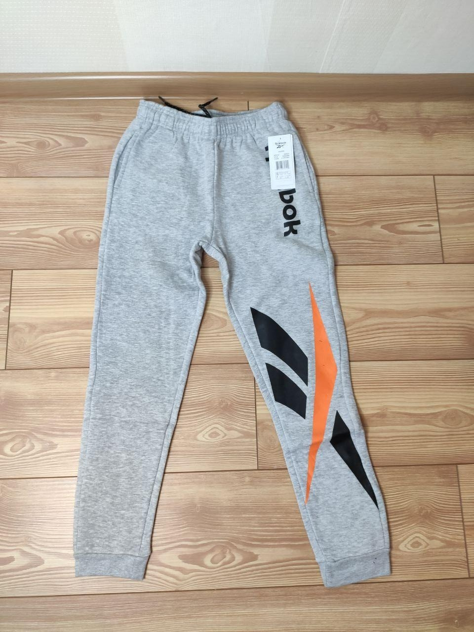 ОРИГІНАЛ Сірі дитячі штани-джогери reebok ew8534