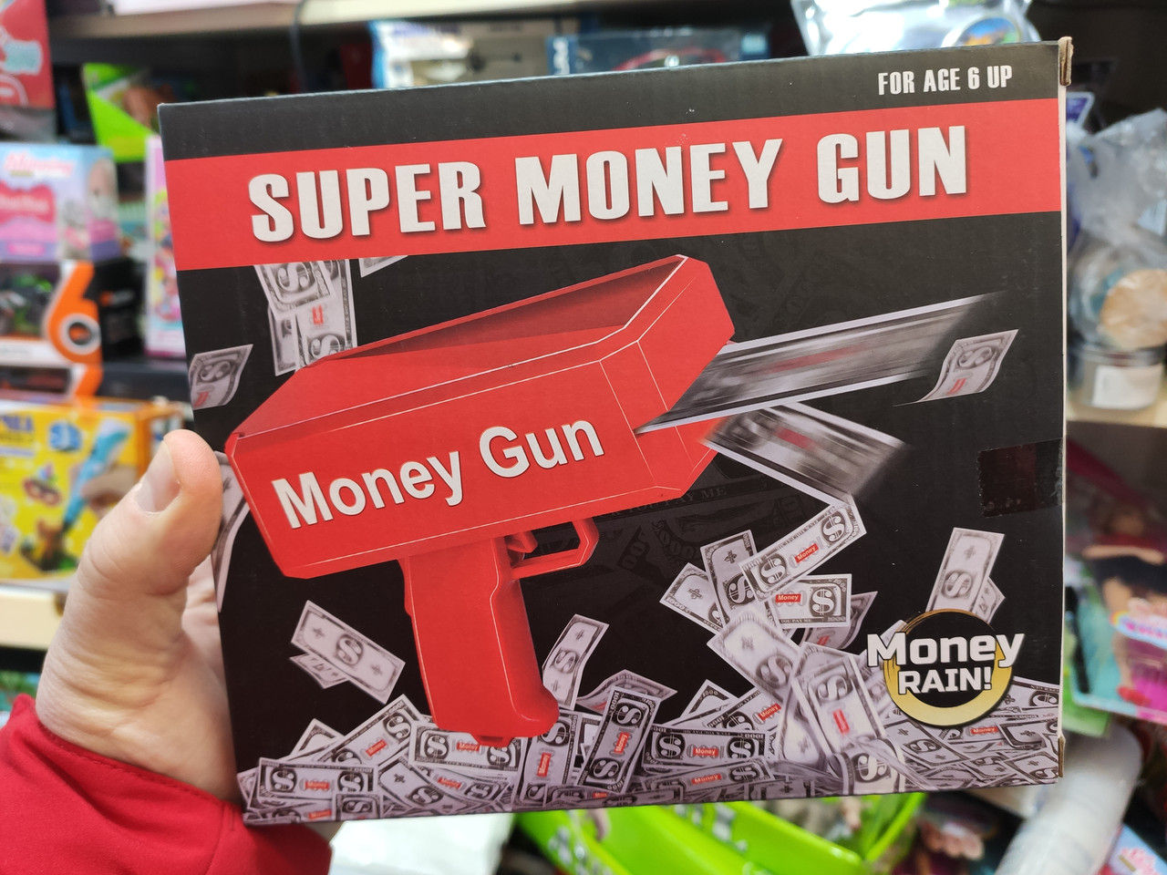 Пістолет який стріляє грошима Supreme money gun