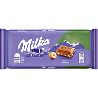 Шоколад молочний Milka Huzelnuts з подрібненим лісовим горіхом 100 грам