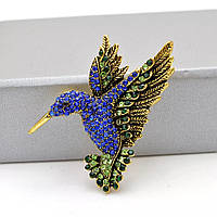 Брошь булавка колибри синего цвета в ярких камнях в золотистом обрамлении