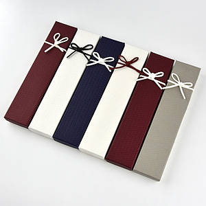 Коробочка прямокутна картонна однотонна з бантом під браслет розмір 21Х45Х23 мм 12 штук в пакованні мікс