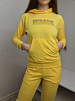 Патріотичний трикотажний жіночий спортивний костюм худої та штани жовтого кольору з написом "Україна"